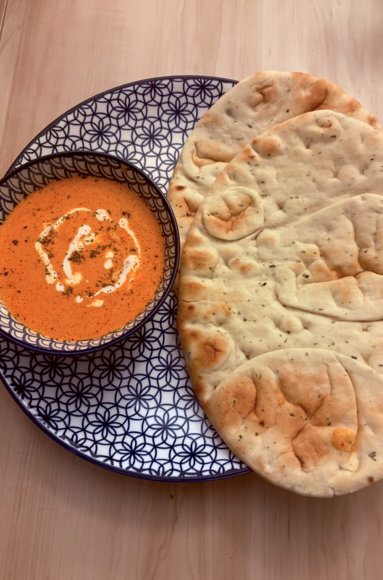 Butter chicken served with naan