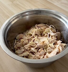 shredded kacha kathal/echor curry/green jackfruit in a bowl