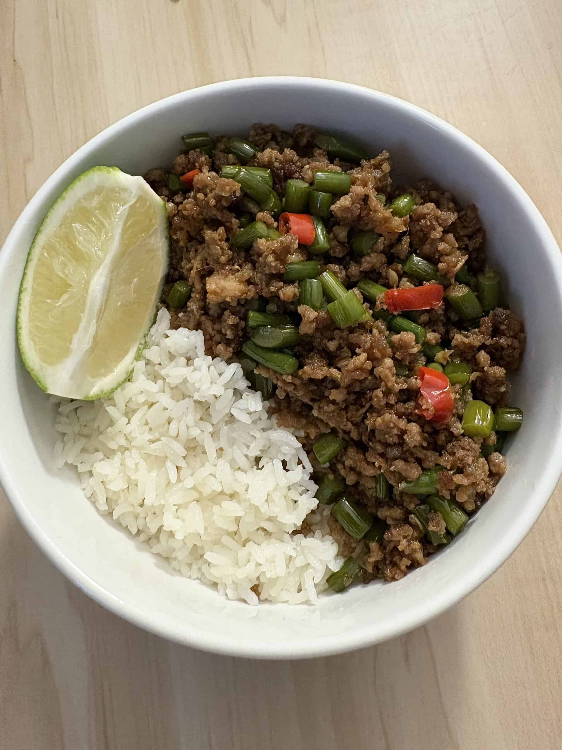 garlic scapes stir fry with minced beed served with white rice.